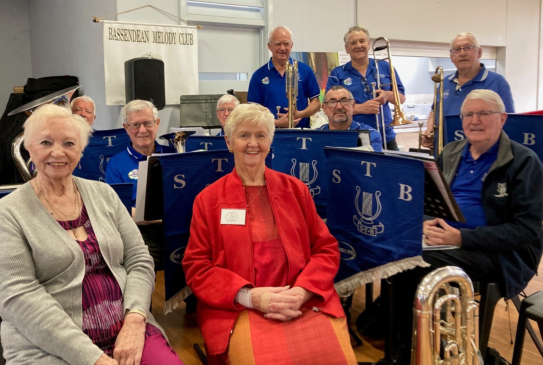 Melody Club President Moira Wilson, Melody Club Treasurer Margaret McCarthy and Silver Threads Band members.